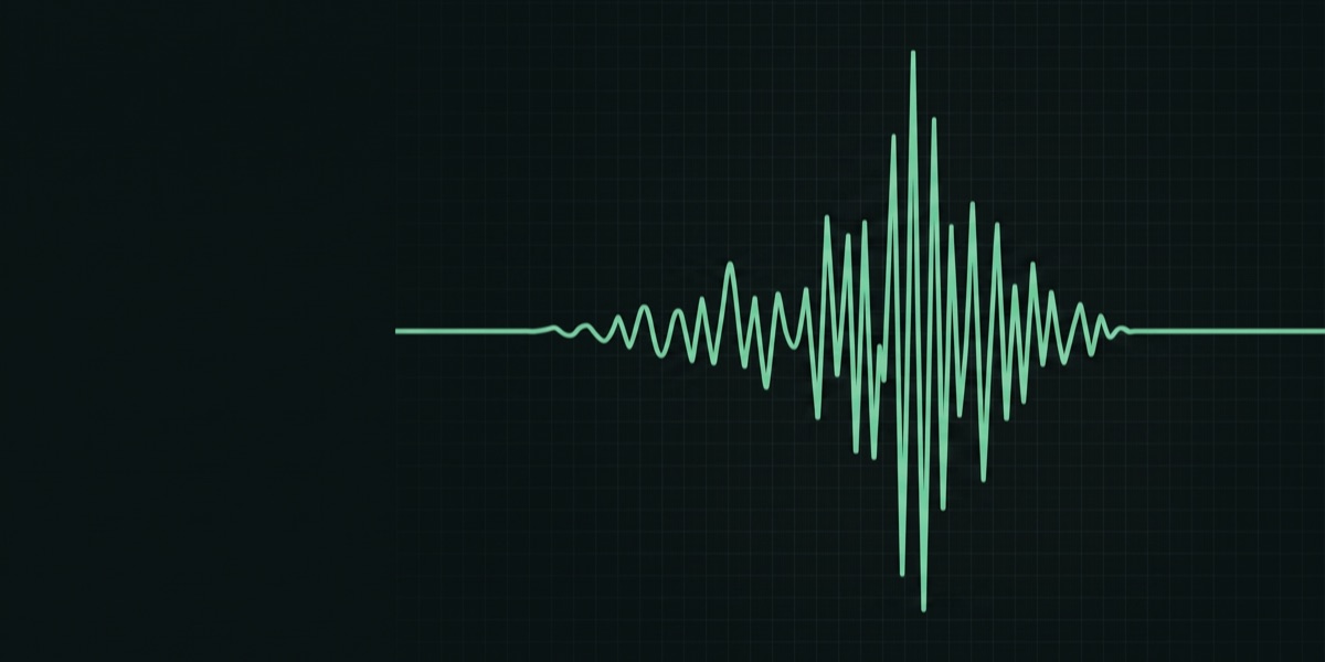 Seismic waveform on a dark monitor beside an out-of-focus sensor — reading GeoShake ground-motion data with ObsPy