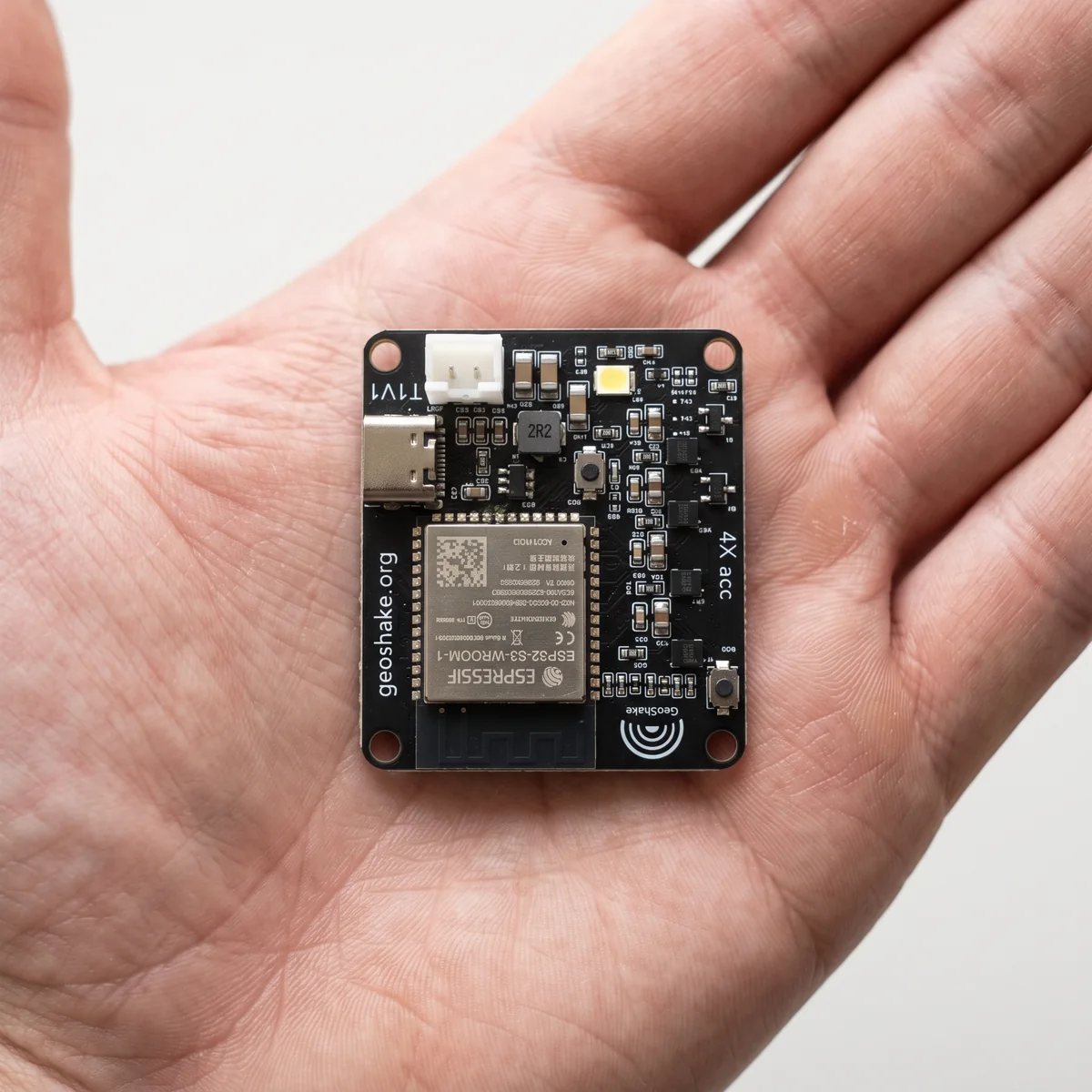 The board held in a hand, showing its size